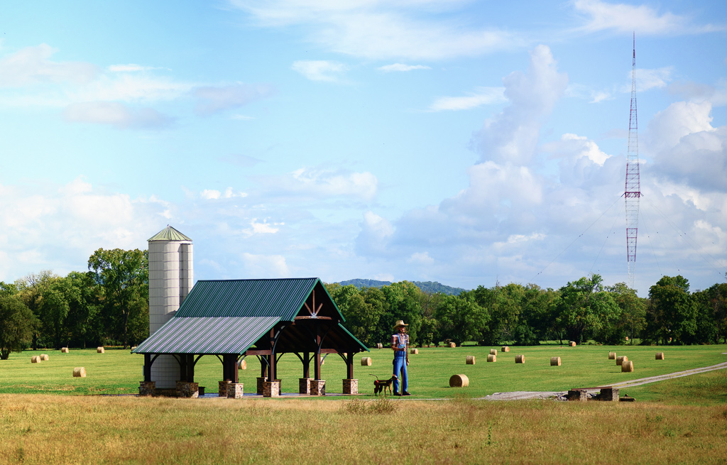 Green Pastures Farm in Brentwood TN with Farmer Luther sculpture and the WSM Tower in the background